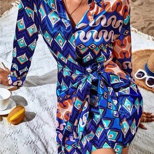 Geometric long sleeved wrap detailed dress.